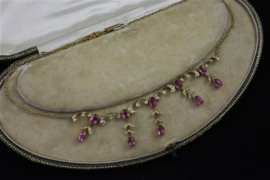 An Edwardian 15ct gold, pink tourmaline and seed pearl necklace, 16in.